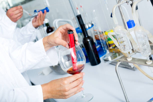 Wine being checked on component saturation in laboratory Wine being checked on component saturation in laboratory on winery factory soil tester stock pictures, royalty-free photos & images