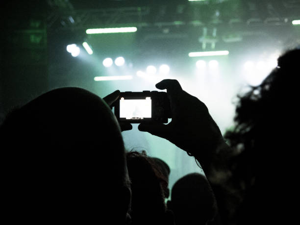 istock Concert crowd filming with smart phones 841547142