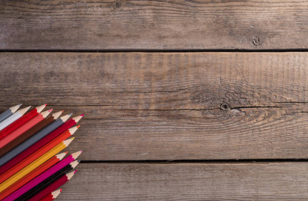 istock Back to school concept background with colored pencils on wooden table, flat lay 841554004