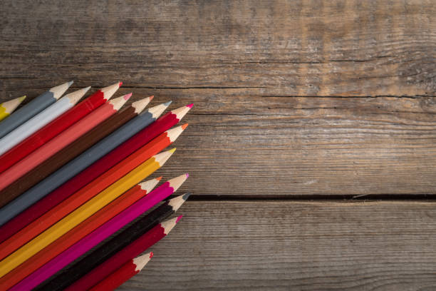 istock Back to school concept background with colored pencils on wooden table, flat lay 841554114