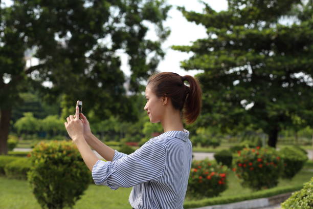 istock Young girl using smartphone in Vietnam 841554390