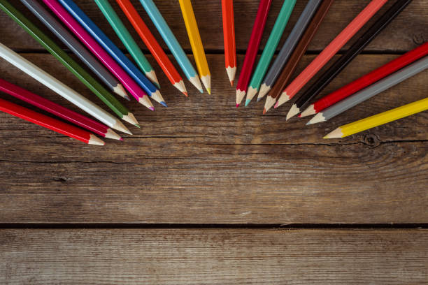 back to school concept background with colored pencils on wooden table, flat lay - ravena imagens e fotografias de stock