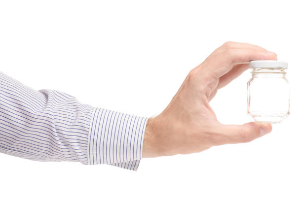 istock Male hands with a small jar 841554696
