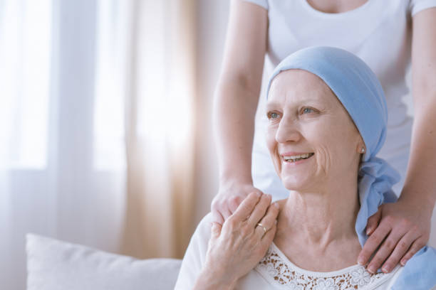 istock Smiling cancer woman with daughter 841554914