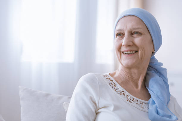 Cancer woman smiling with hope stock photo