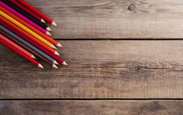 back to school concept background with colored pencils on wooden table, flat lay - ravena imagens e fotografias de stock