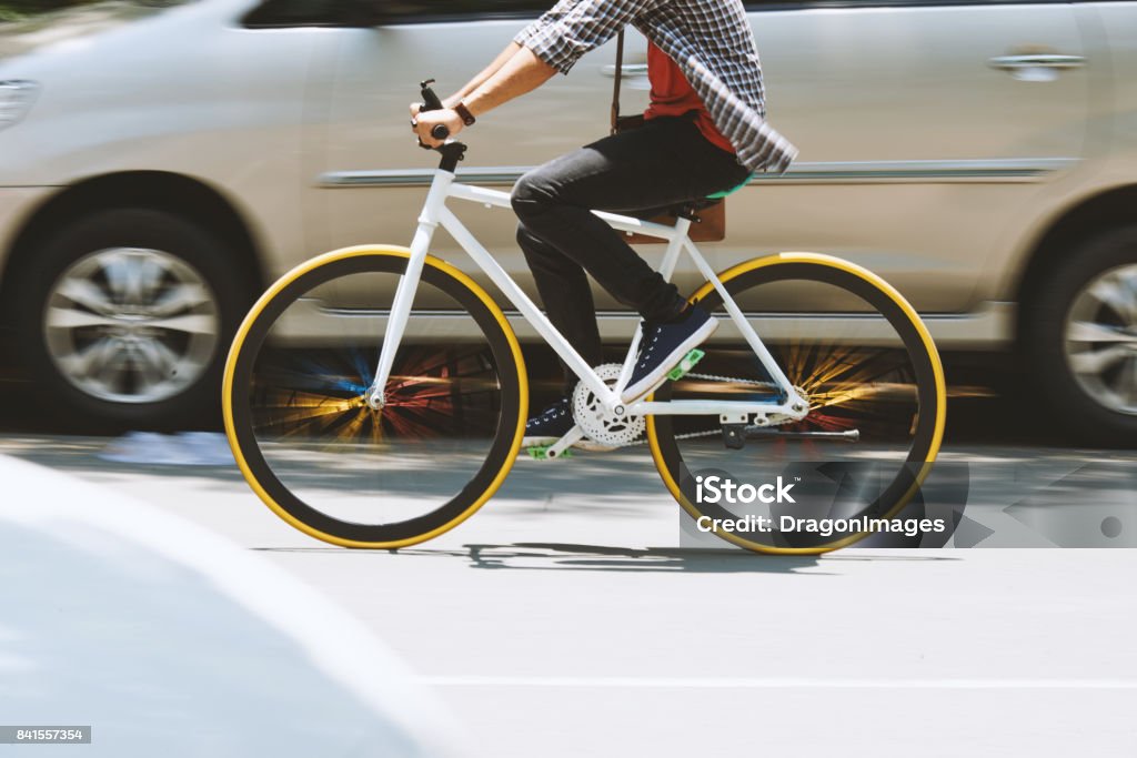 Cycling on the road Man riding on bicycle on the road, blurred motion Cycling Stock Photo