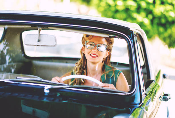 istock Beautiful happy woman sitting in a car 841558020