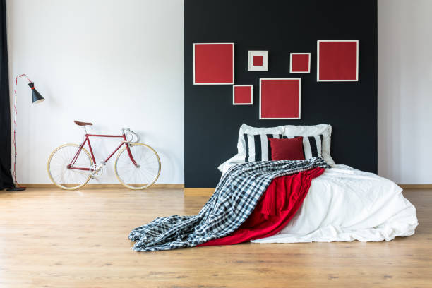 istock Red coverlet on king-size bed 841558846