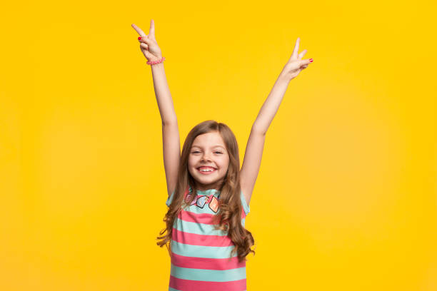 istock Young girl holding hands up smiling 841559138