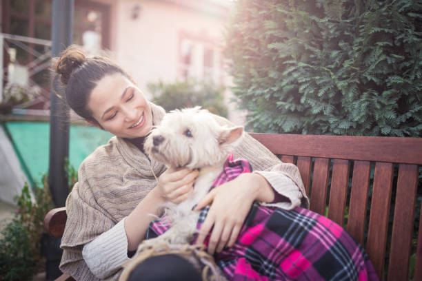 istock Beautiful young woman with dog 841565848