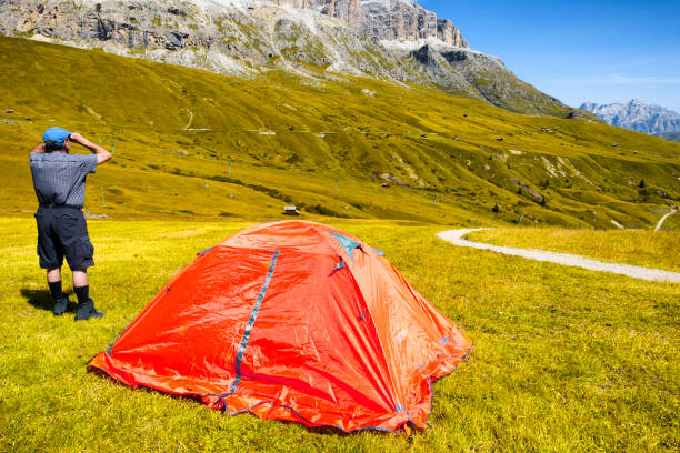 istock Man with binoculars in Dolomites Alps 841570928