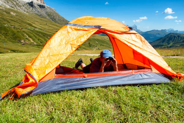 istock Man with binoculars in Dolomites Alps 841570966