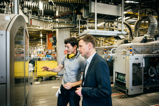 istock Manager and Engineer discussing in big factory 841574730