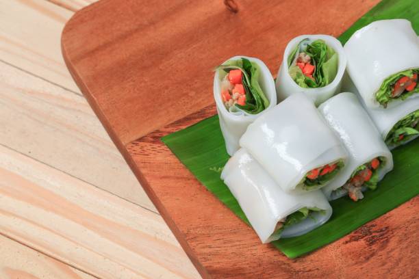 istock spring roll and vegetable  on banana leaf in plate, Select focus with shallow depth of field. 841577702