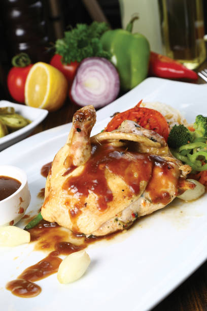 istock Roasted chicken legs and vegetables 841580486