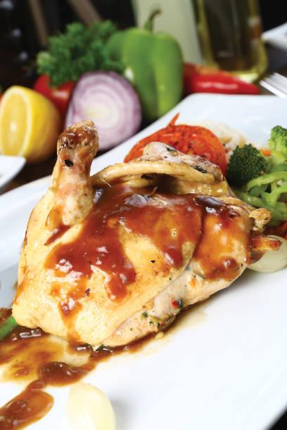 istock Roasted chicken legs and vegetables 841580490