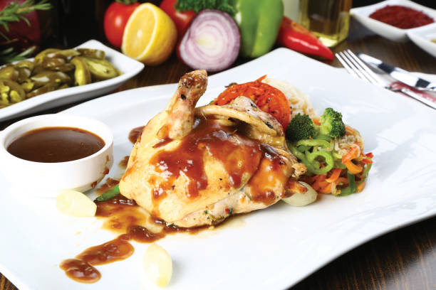 istock Roasted chicken legs and vegetables 841580502