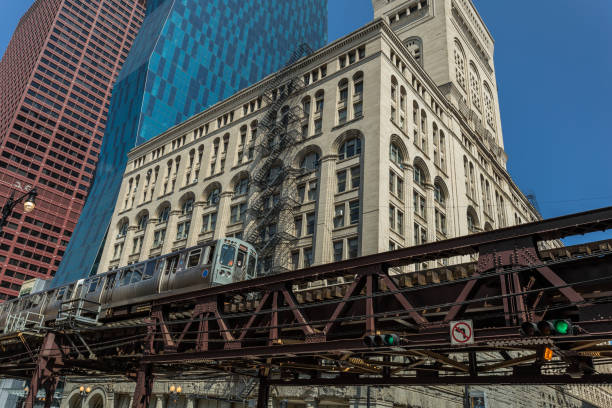 istock Train rolling in front of vintage building 841584648