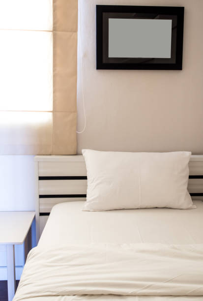 istock White blanket and pillow on bed in bedroom 841584978