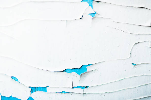 istock Texture of a peeling white and blue paint on an old wooden surface. 841588950