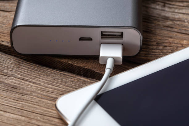 istock Smartphone charging with power bank. 841595418