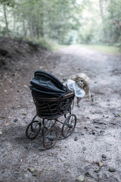 Closeup of a vintage pram from the 1960s and 70s in black and white.