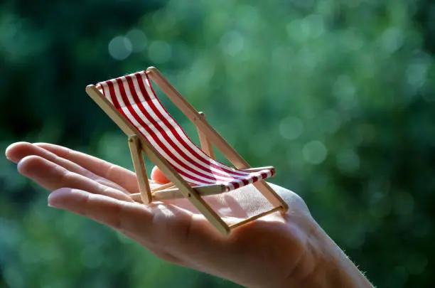 little small beachchair in the hand close up