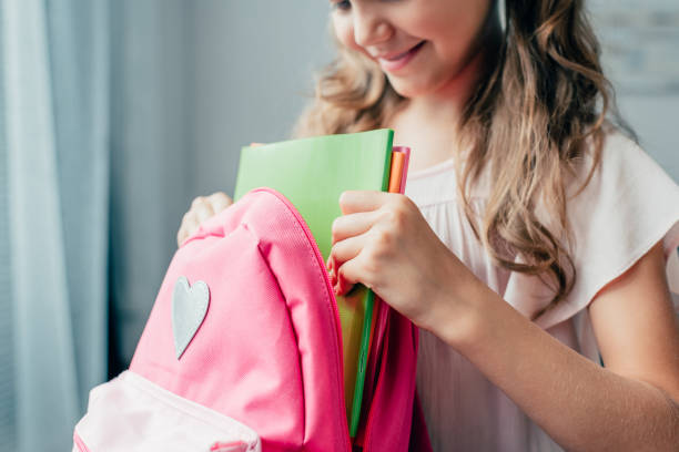 istock cropped shot of girl preparing backpack for school 841604006