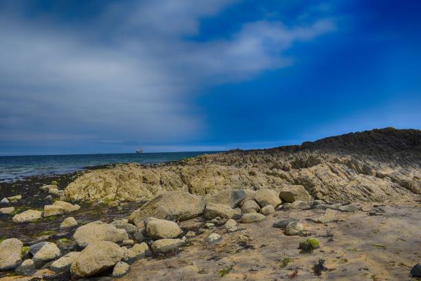 istock rock formation on edge of sea 841613516