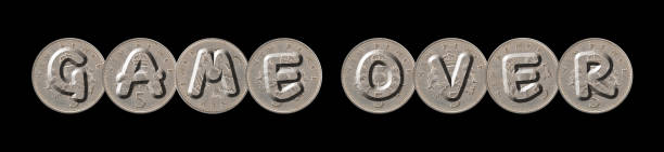 istock GAME OVER – five new pence coins on black background 841614378