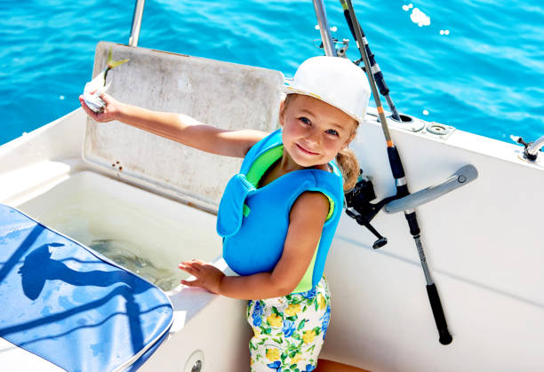 istock Little girl holding a fish 841614452