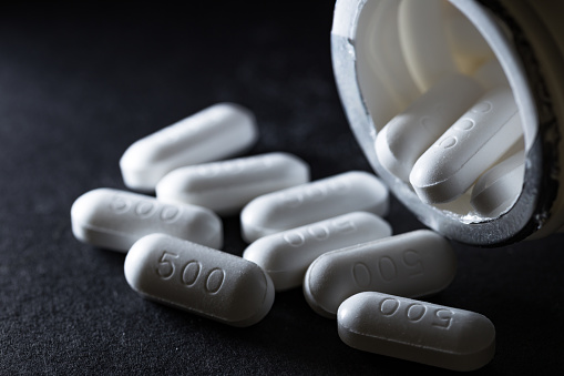 Paracetamol medicine tablets on dark background