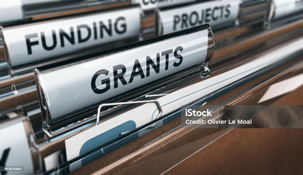 Seeking Grants for an Association, a Small Business or for Research View of brown folders, with focus on grants label, Concept of funding, 3D illustration Giving Stock Photo