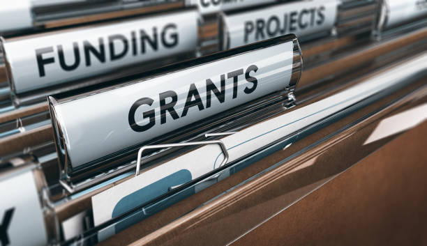 Seeking Grants for an Association, a Small Business or for Research View of brown folders, with focus on grants label, Concept of funding, 3D illustration giving stock pictures, royalty-free photos & images