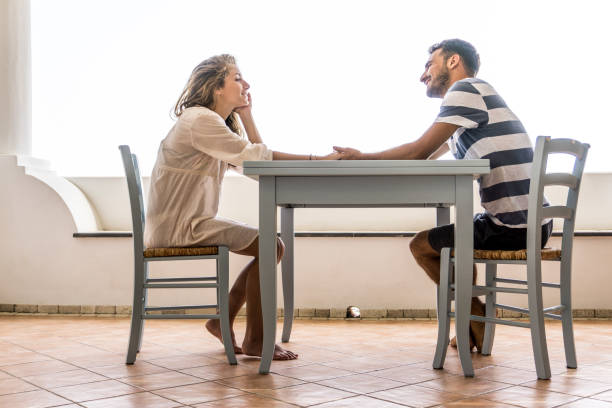 Young couple sitting at the table