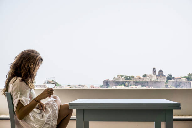 istock Young woman sitting at the table 841621562
