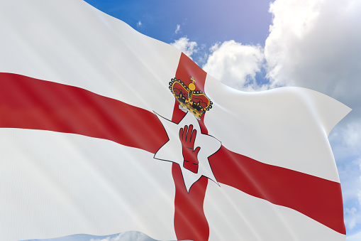 3D rendering of Northern Ireland flag waving on blue sky background, Northern Ireland is part of the United Kingdom. The country is known for Norman castles, This flag normally using for Football team