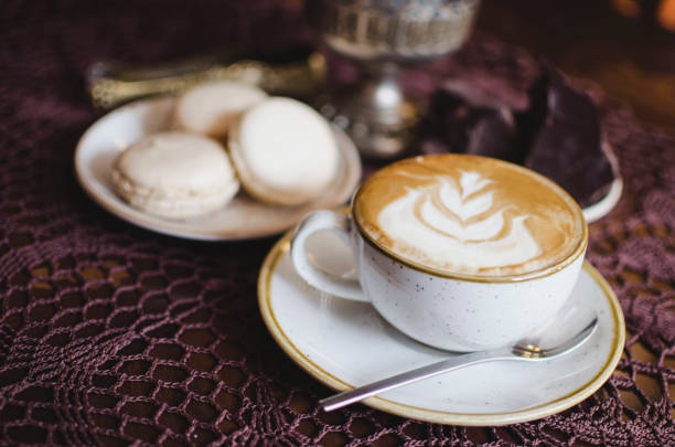 istock Coffee latte on the wooden retro table. 841625430