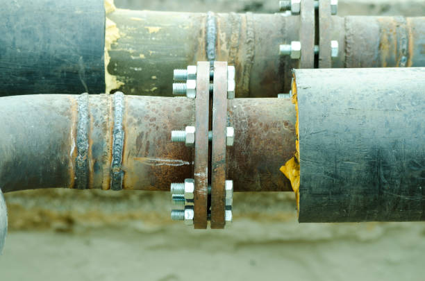 istock Two welded pipes with bolts and insulation close up 841628522