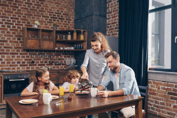 istock young happy family having breakfast in loft kitchen 841635928