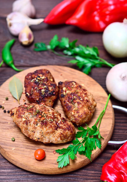 istock Meat cutlets on a wooden board 841639292