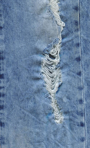 istock Jeans torn denim texture. Denim jeans ripped 841639512