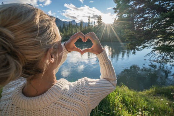 istock Young woman loving nature at sunset 841643842