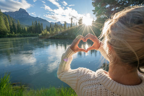 istock Young woman loving nature at sunset 841646244