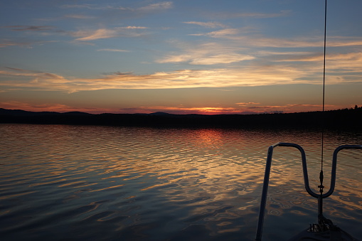 Sunset at the still water, yacht on the lake.Sailboats on the beautiful Lake.Beautiful sea landscape.