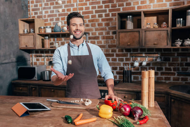 istock happy young man throwing up raw mushrooms 841654070