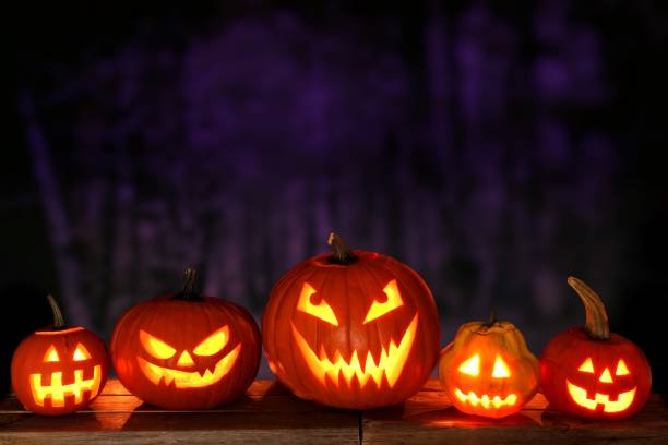 istock Halloween Jack o Lanterns at night against a spooky background 841654216