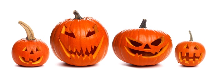 Group of unique unlit Halloween Jack o Lanterns individually isolated on a white background