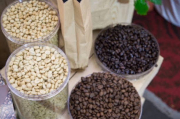 istock Coffee beans in plastic tray  on brown wooden background ,blurry background 841657320
